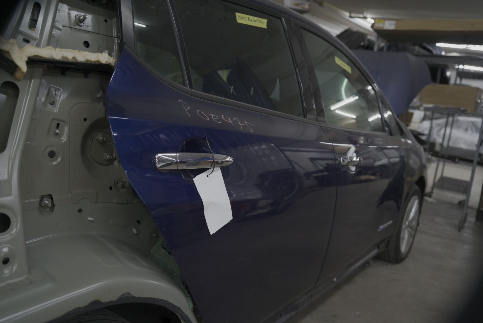 Hail damage repair Vancouver WA - Five Star Auto Body technician performing paintless dent removal on vehicle panel
