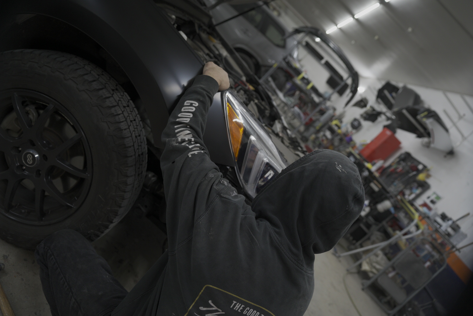 Headlight assembly removal during collision structural repair at Five Star Auto Body